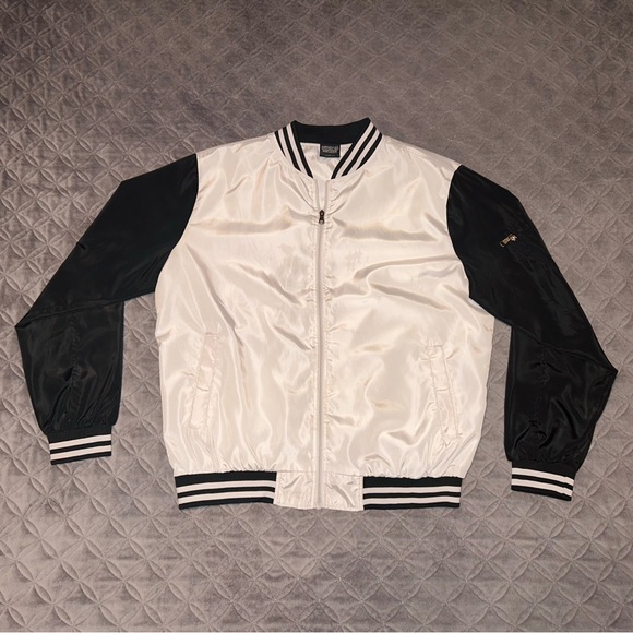 Bomber Jacket that is Zip-Up and has a pocket on the left arm. 100% Polyester. - Picture 2 of 2